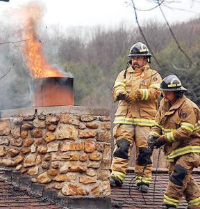 improper use - firemen putting out chimney fire